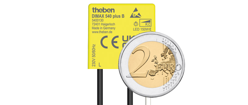 Gelber Unterputz-Dimmer mit Zwei-Euro-Münze zum identlischen Größenvergleich